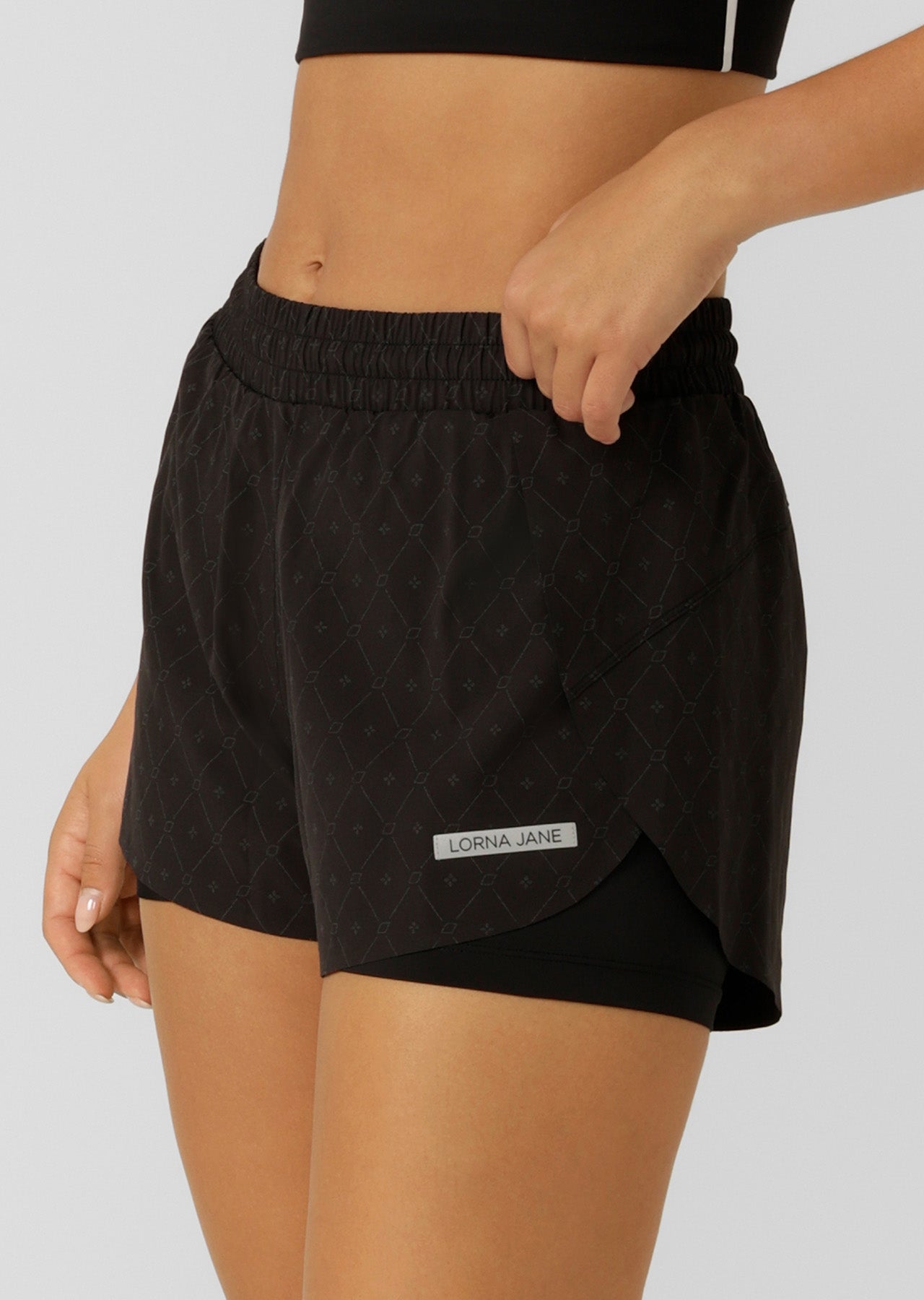 Lorna Jane Reflective Lightspeed Phone Pocket Run Shorts - Black Reflective Monogram Print